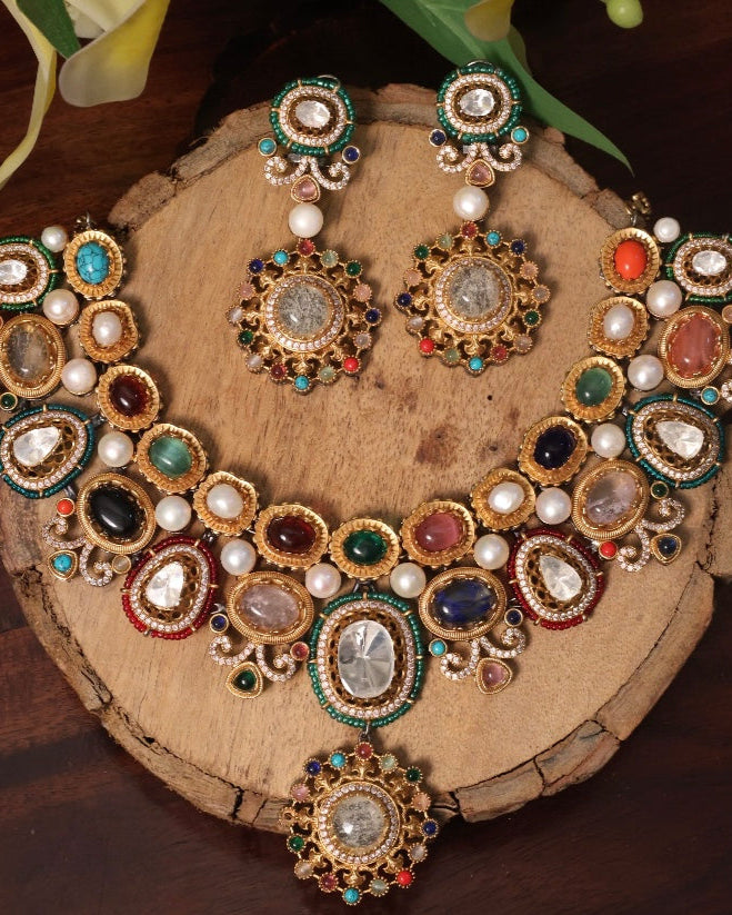 Navratna kundan necklace set with pearl accents and multicolor stones in bold design
